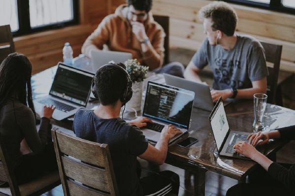 Picture of young people working on laptops